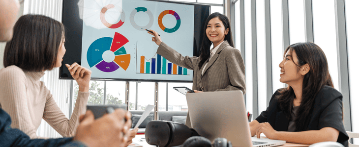 A manager presents reports to a meeting